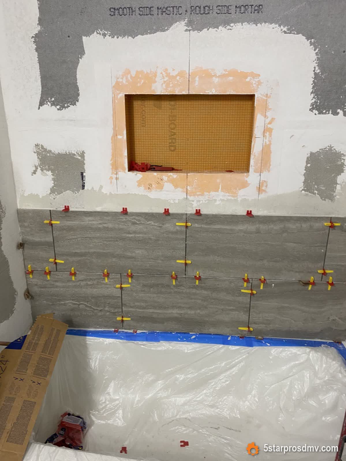Impermeabilización de pared de ducha e instalación de azulejo en progreso por 5 Star Pros DMV