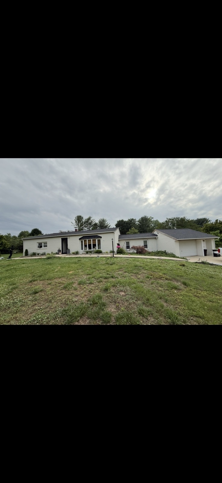 After: brick house freshly painted by 5 Star Pros in the DMV area