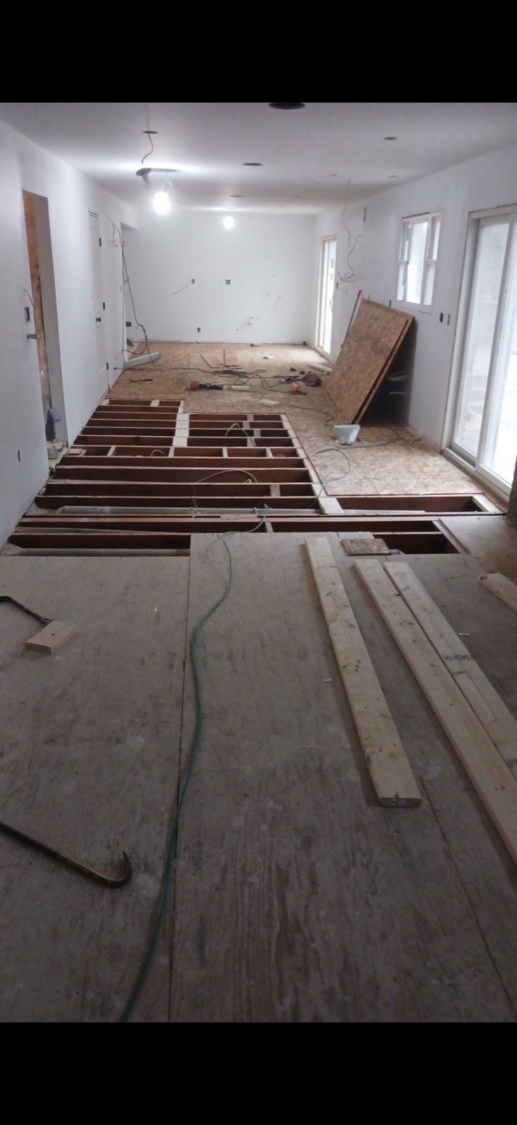 Subfloor framing and flooring renovation in progress by 5 Star Pros DMV