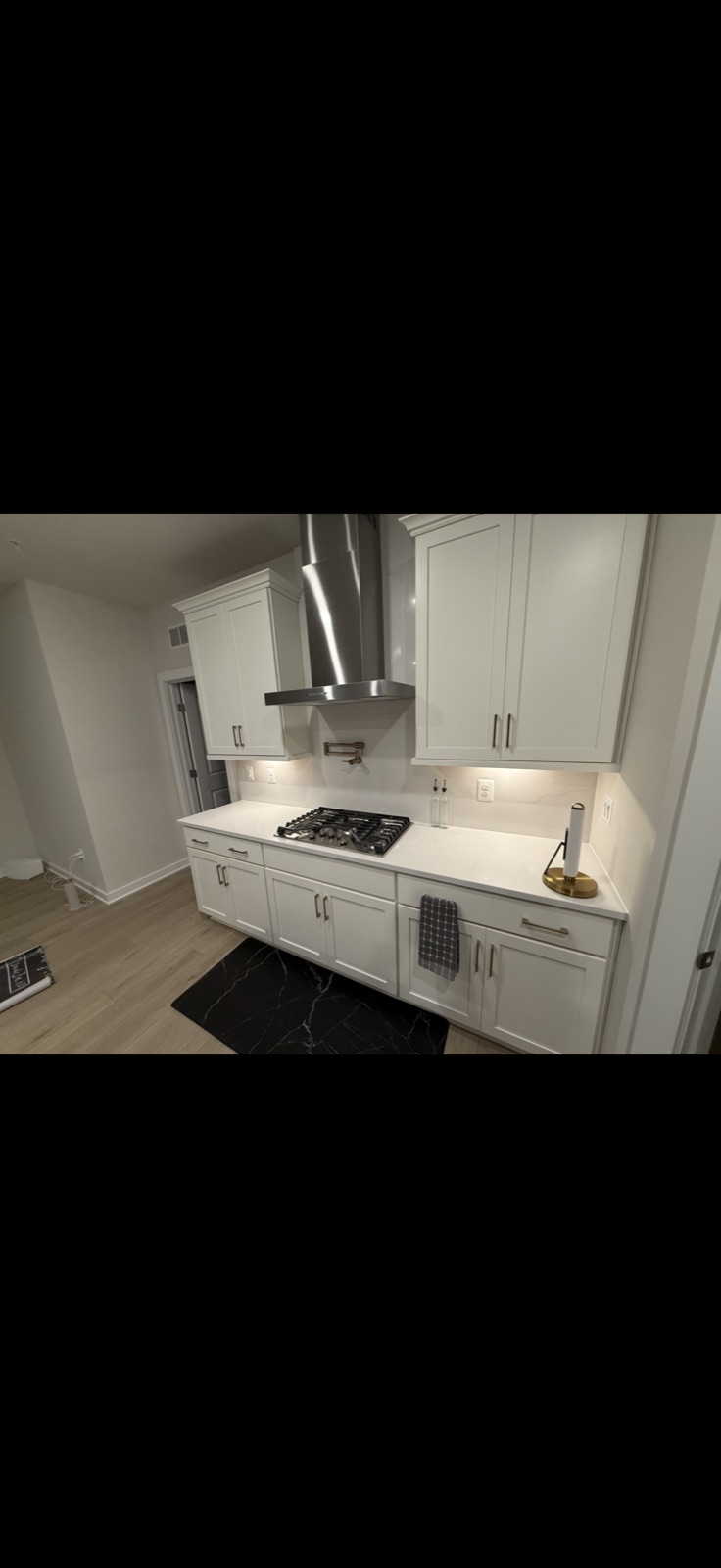 White kitchen renovation with quartz countertop and stainless range hood, 5 Star Pros, DMV