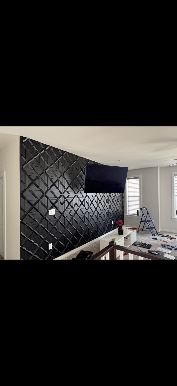 3D black geometric wall panel installation with TV mount by 5 Star Pros, DMV area